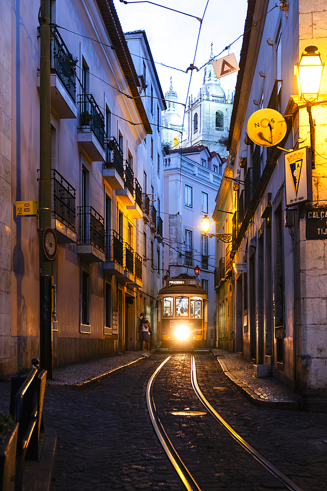 Tram in an alley in the old town of Lisbon, Portugal, Europe