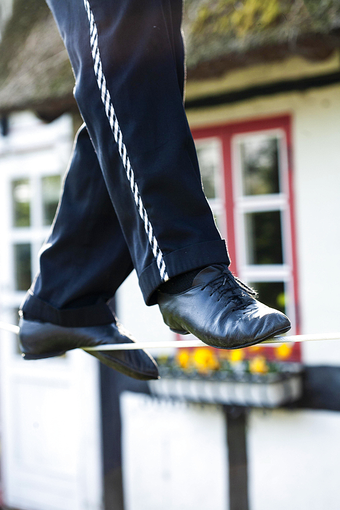 An artist on a tightrope, high wire