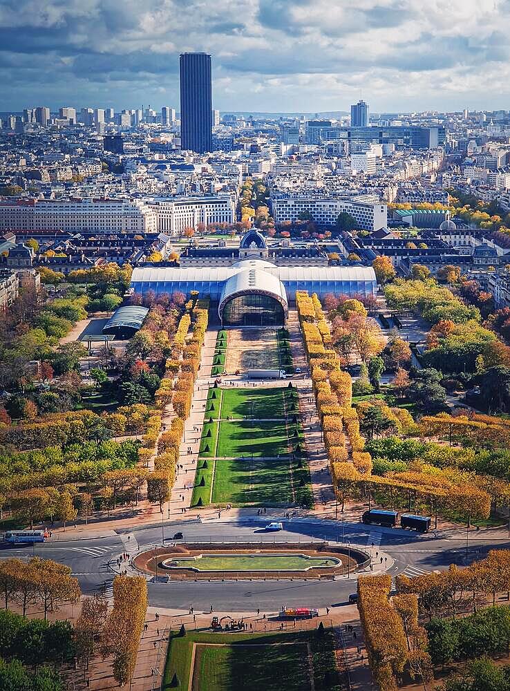 Scenery view to the Paris city from the Eiffel tower height, vertical background. Montparnasse tower and Les Invalides seen on the horizon, France, Europe