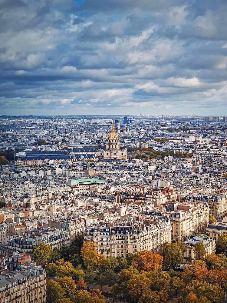 Aerial view of Paris cityscape, France. Les Invalides building with golden dome. Autumn parisian scene, vertical background