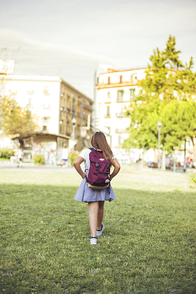 Schoolgirl walking city park