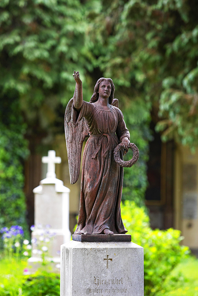 Angel figure at the burial ground of St. Sebastian's Cemetery, Church of St. Peter, Salzburg, Austria, Europe