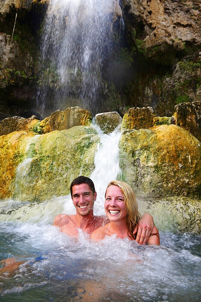 Couple bathing in Main Hot Springs, Wadi Main, Madaba, Jordan, Asia