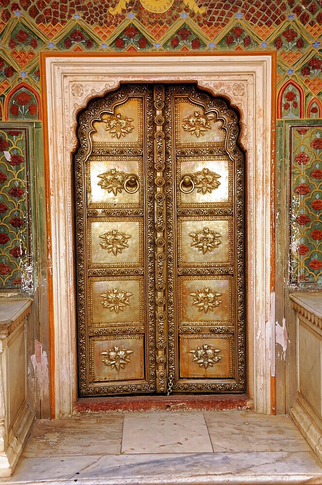City Palace Jaipur, Rajasthan, North India, India, Asia, Golden decorated door with floral patterns in architectural frame