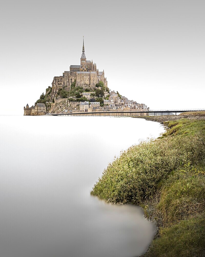 Long exposure of the famous Mont Saint Michel monastery mountain on the edge of Normandy and Brittany, France