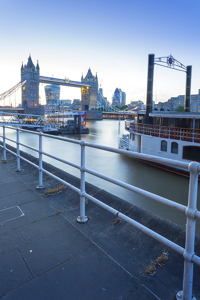 Tower Bridge, traditional riverboat and City of London skyline from Butler's Wharf, London, England, United Kingdom, Europe