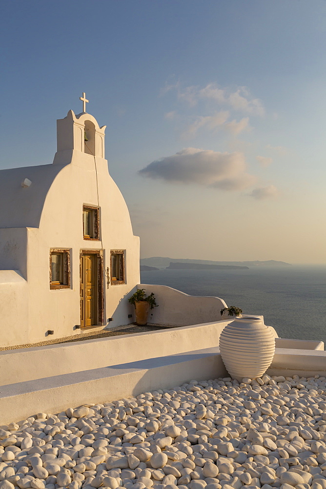 View of traditional white washed church at sunset in Oia, Santorini, Cyclades, Aegean Islands, Greek Islands, Greece, Europe