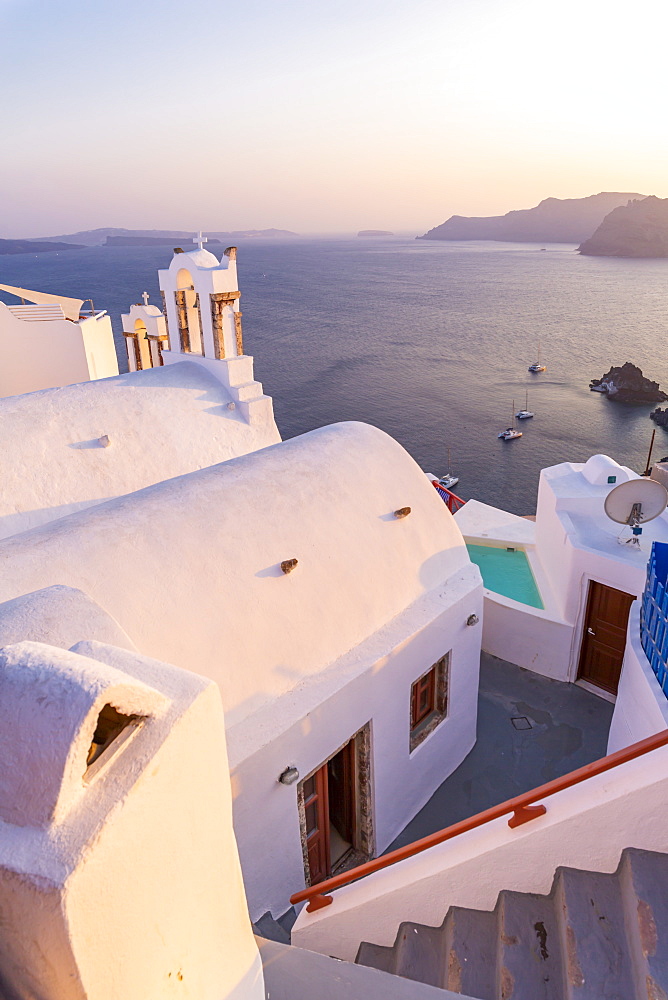 View of traditional blue domed church in Oia, Santorini, Cyclades, Aegean Islands, Greek Islands, Greece, Europe