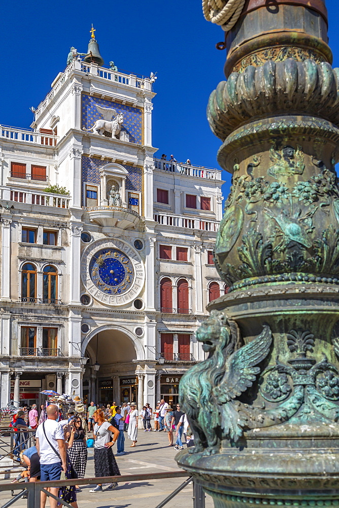 View of Torre dell'Orologio and ornate lamp post in St. Mark's Square, Venice, UNESCO World Heritage Site, Veneto, Italy, Europe