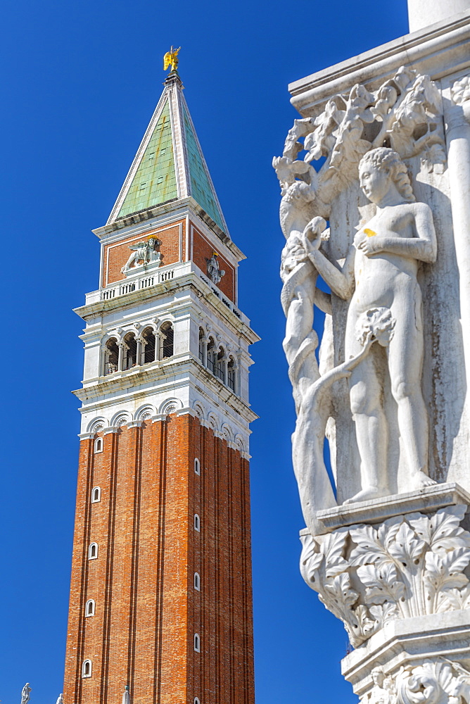 View of the Campanile and sculpture on Doge's Palace in St. Mark's Square, Venice, UNESCO World Heritage Site, Veneto, Italy, Europe