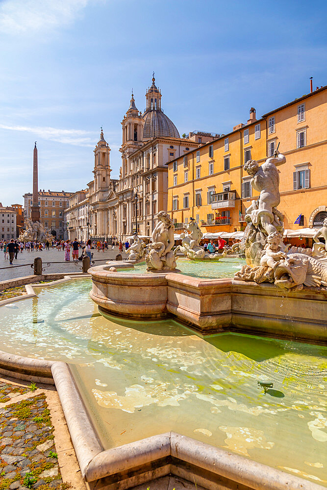 View of the Neptune Fountain and colourful architecture in Piazza Navona, Piazza Navona, UNESCO World Heritage Site, Rome, Lazio, Italy, Europe