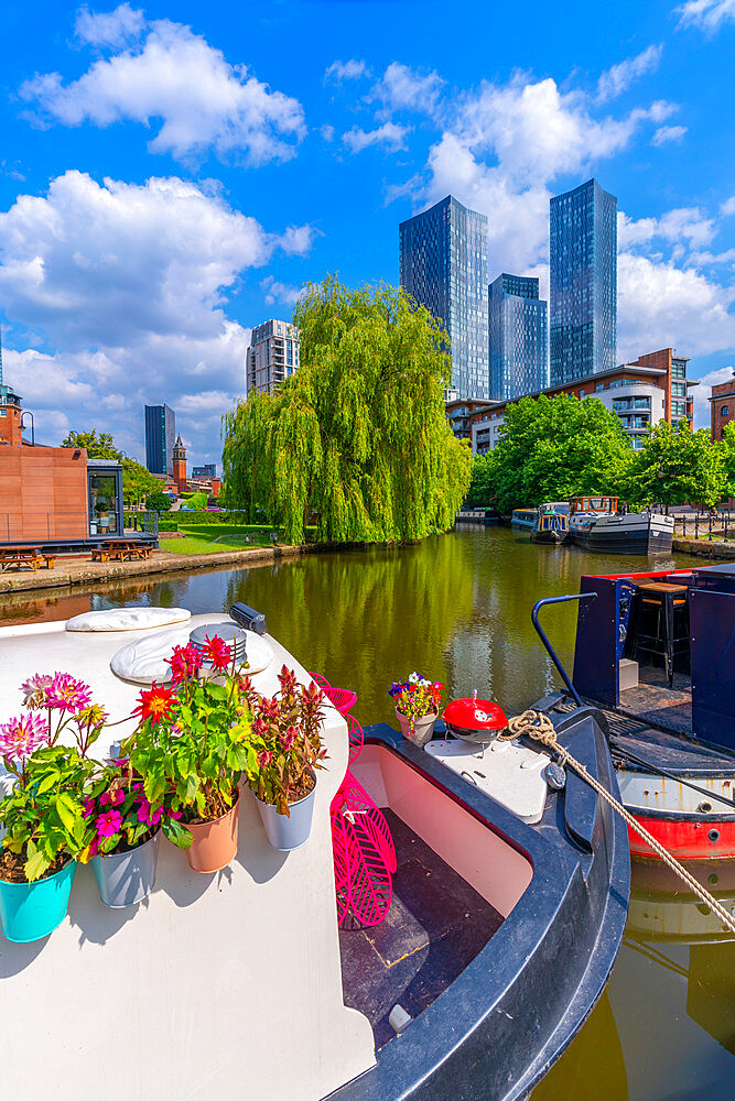 View of canal boat and contemporary skyline from Castlefield, Castlefield Canal, Manchester, England, United Kingdom, Europe