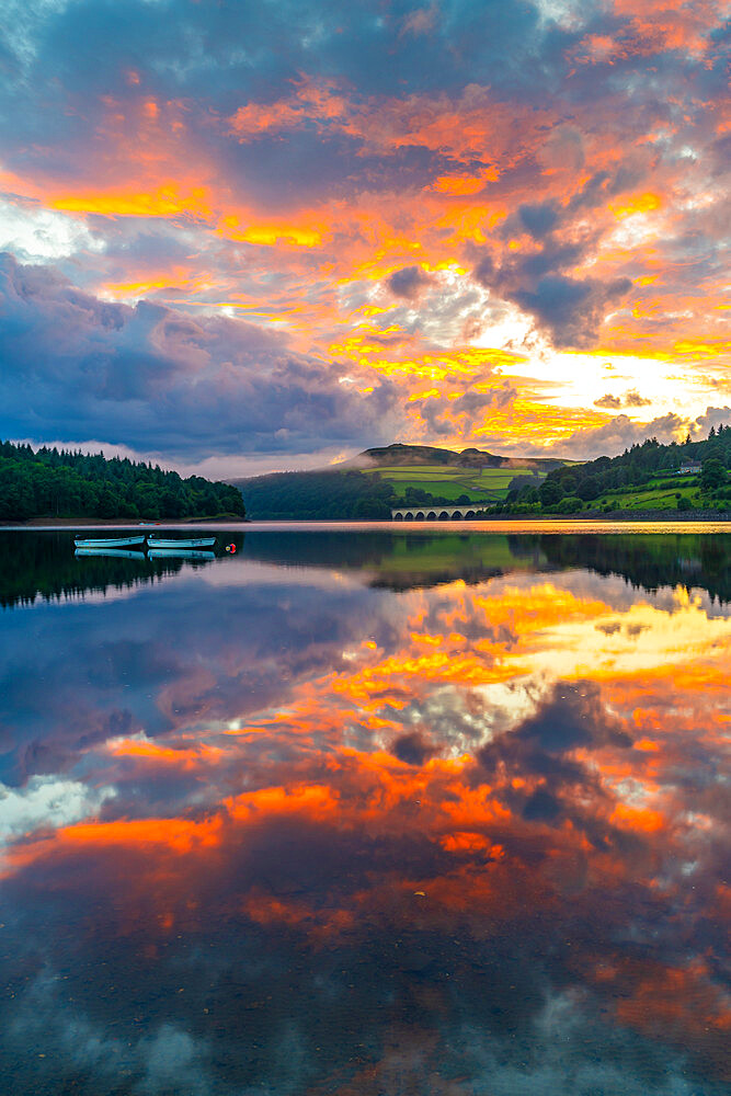 View of dramatic clouds reflecting in Ladybower Reservoir at sunset, Peak District National Park, Derbyshire, England, United Kingdom, Europe