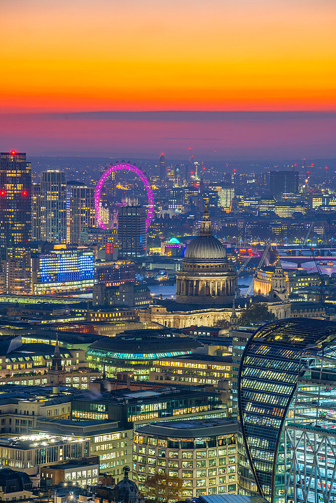 View of London Eye and St. Paul's Cathedral at dusk from the Principal Tower, London, England, United Kingdom, Europe