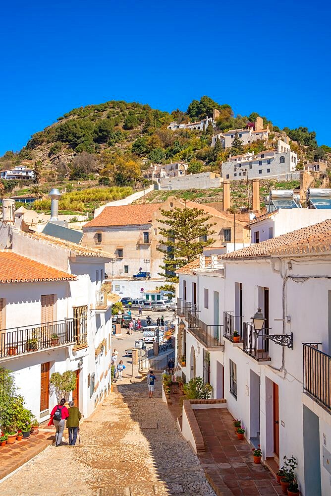 View of white washed houses and mountains in background, Frigiliana, Malaga Province, Andalucia, Spain, Europe