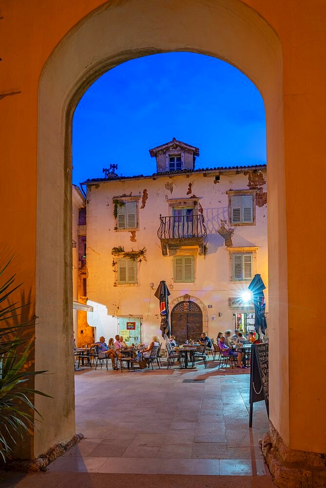 View of restaurants at dusk, Lovran, Kvarner Bay, Eastern Istria, Croatia, Europe