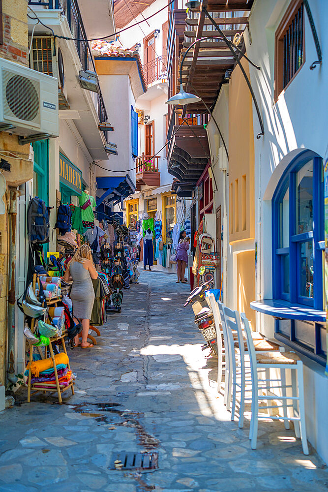 View of shops in narrow street, Skopelos Town, Skopelos Island, Sporades Islands, Greek Islands, Greece, Europe