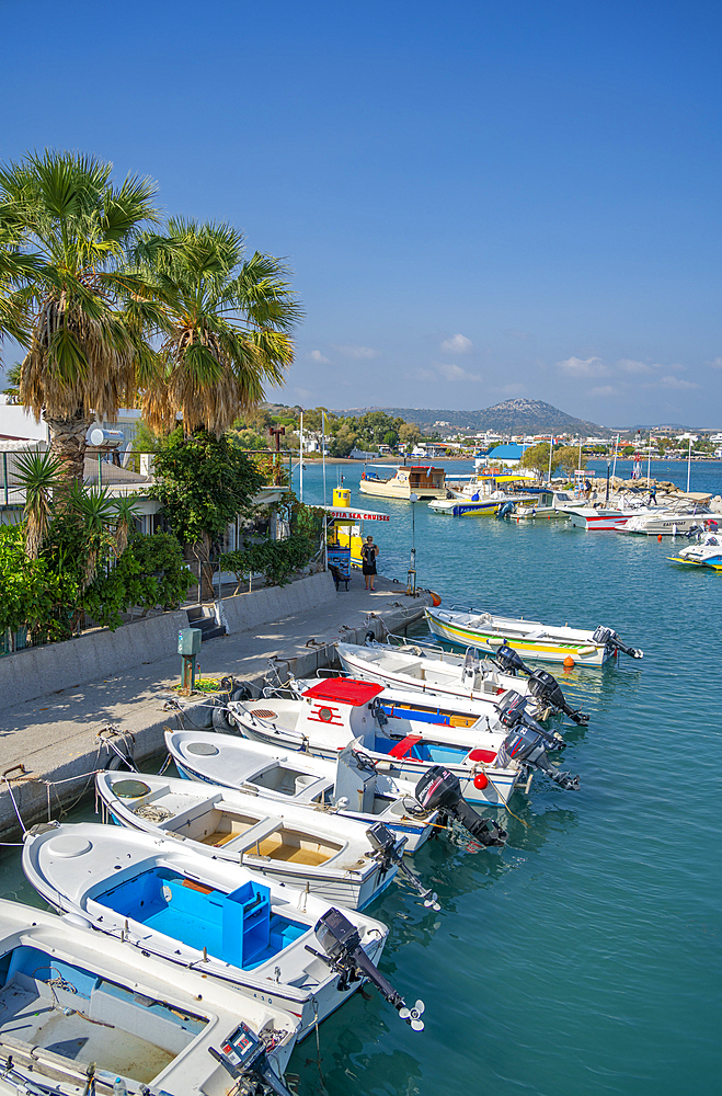 View of Faliraki Harbour and little white chapel, Faliraki, Rhodes, Dodecanese Island Group, Greek Islands, Greece, Europe