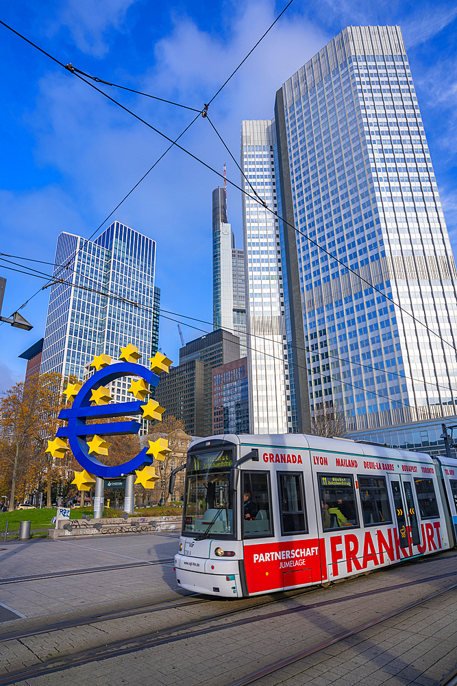 View of financial district skyline, city tram and the Euro Sculpture, Willy Brandt Platz, Frankfurt am Main, Hesse, Germany, Europe