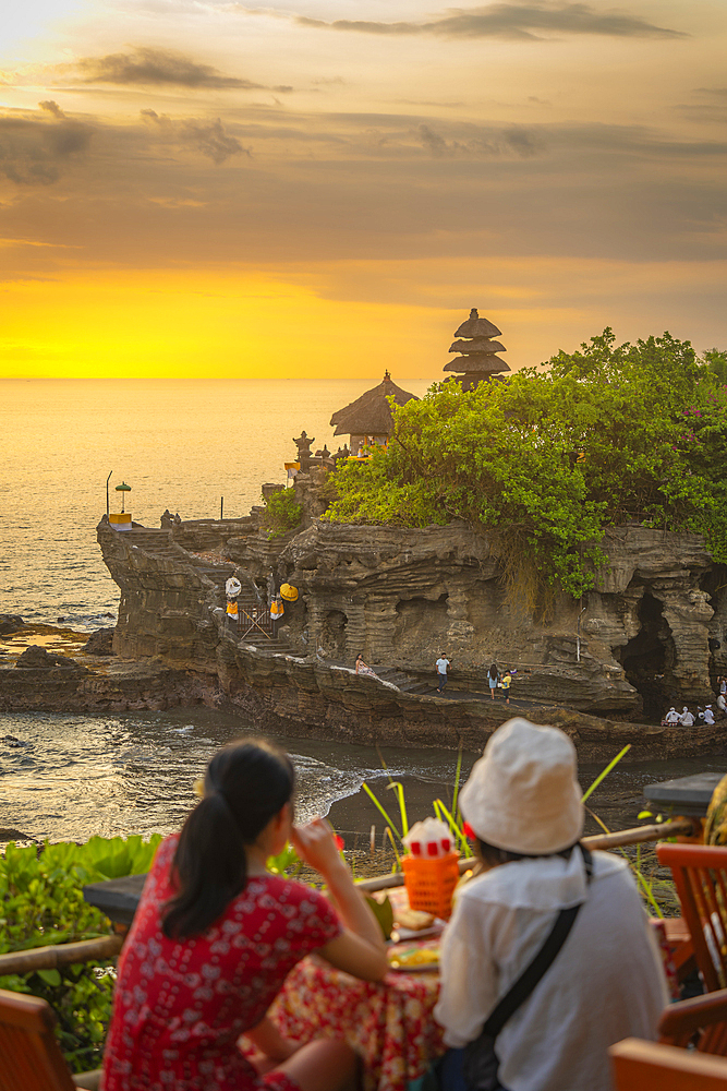 Tourists at Tanah Lot, traditional Balinese temple at sunset, Beraban, Kediri, Tabanan Regency, Bali, Indonesia, South East Asia, Asia