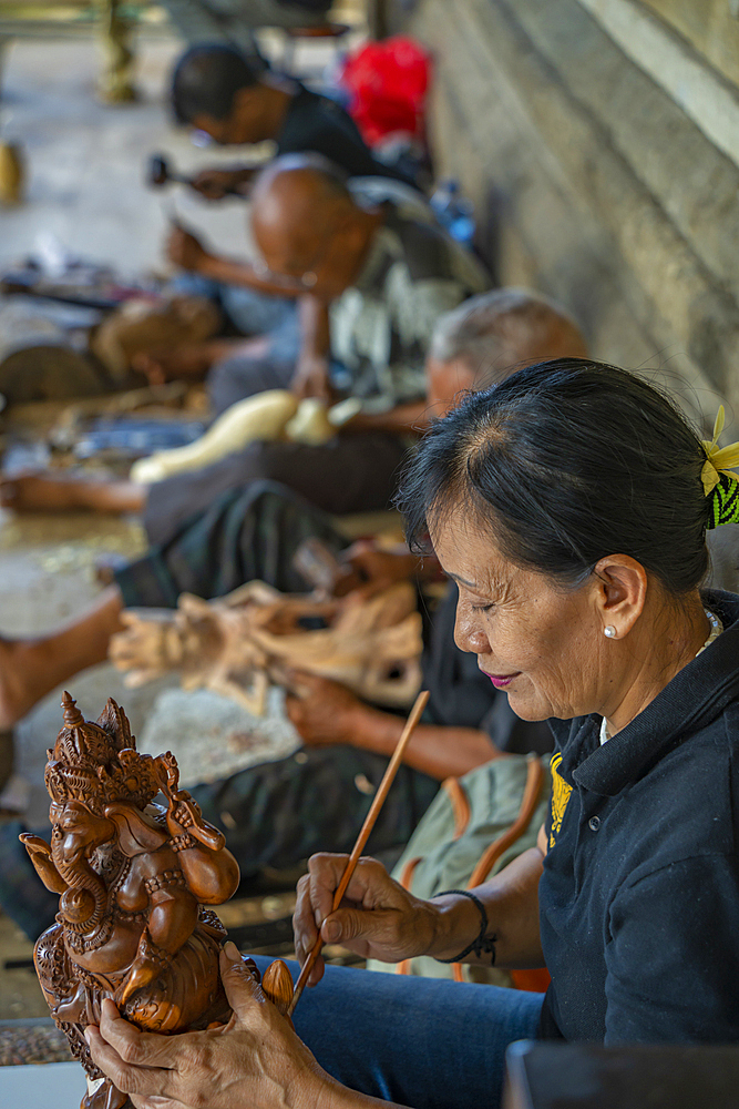 Wood carving skills near Sukawat, Denpasar City, Bali, Indonesia, South East Asia, Asia