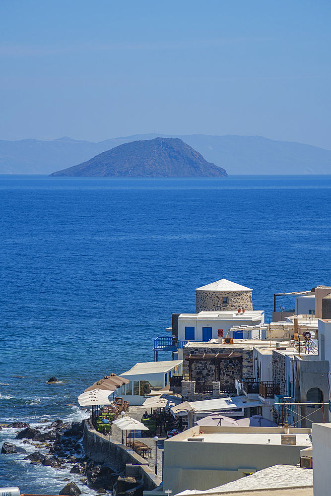 View of sea and whitewashed buildings and rooftops of Mandraki, Mandraki, Nisyros, Dodecanese, Greek Islands, Greece, Europe