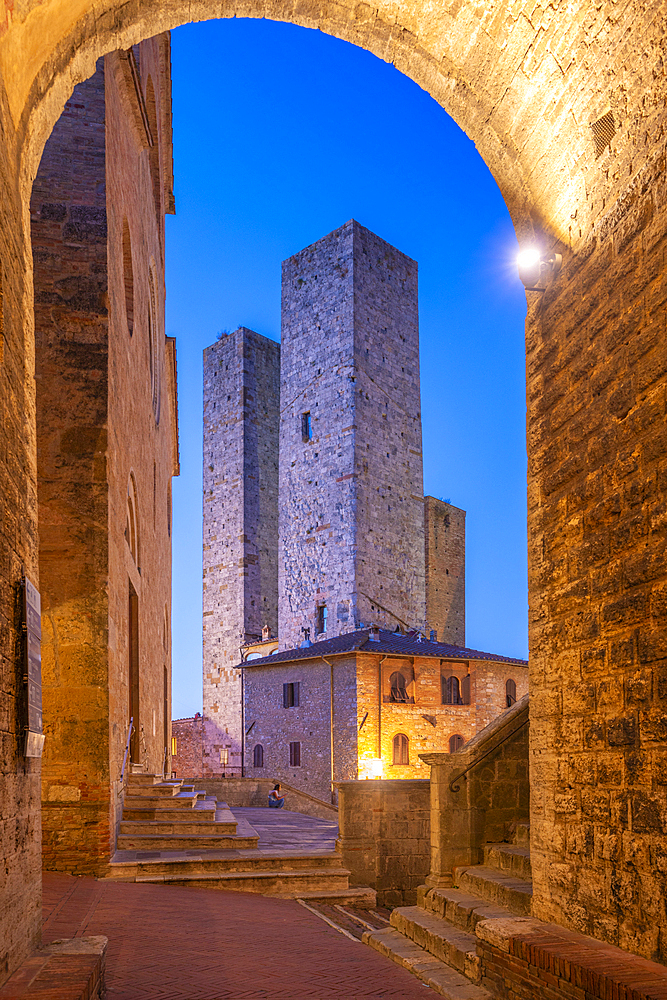 View of towers in Piazza del Duomo at dusk, San Gimignano, UNESCO World Heritage Site, Province of Siena, Tuscany, Italy, Europe