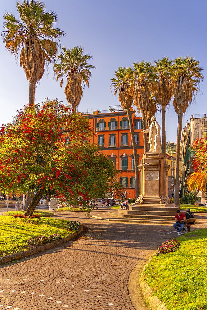 View of Nicola Amore statue and colourful architecture in Piazza della Vittoria, Naples, Campania, Italy, Europe