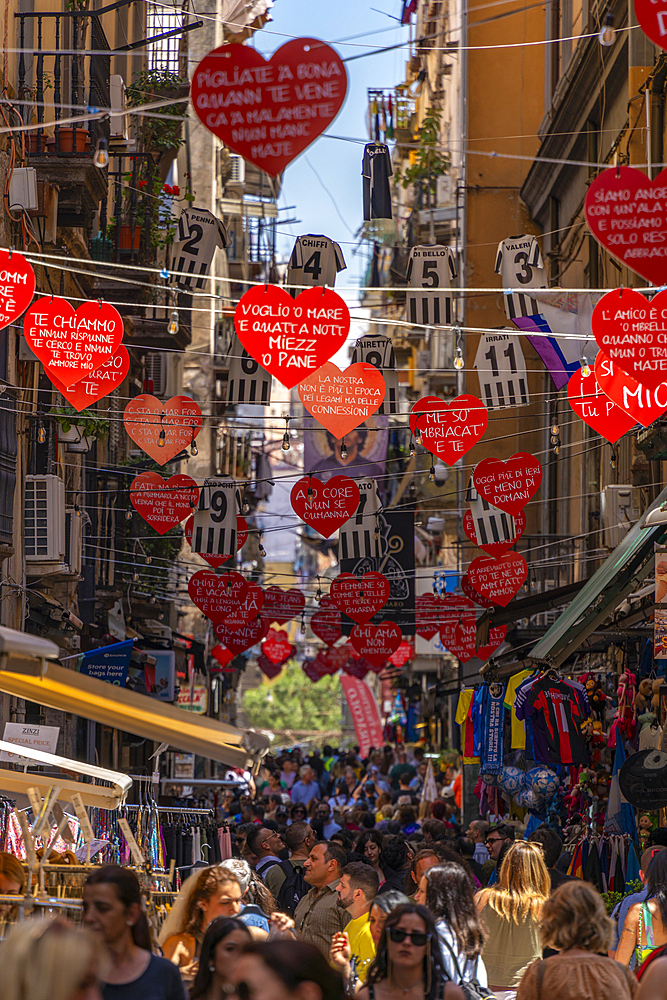 View of shops and decor on bustling Via San Biagio Dei Librai, Naples, Campania, Italy, Europe