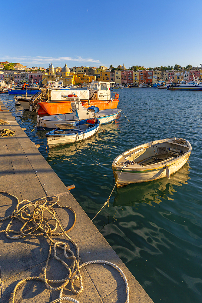 View of Church Madonna delle Grazie in the fishing port Marina Grande with boats at golden hour, Procida, Phlegraean Islands, Gulf of Naples, Campania, Southern Italy, Italy, Europe