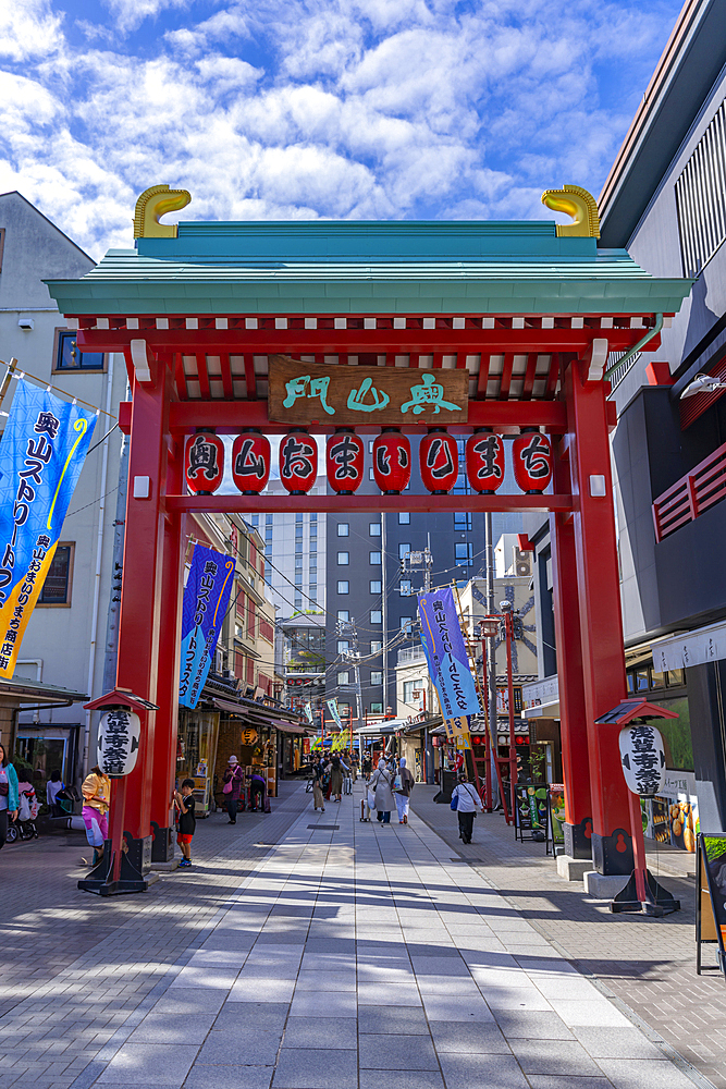 View of Torii gate, colourful shops and buildings in Asakusa, Taito City, Tokyo, Japan, Asia