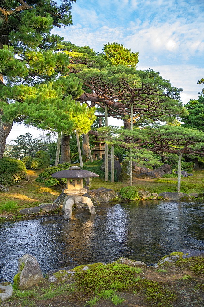 View of Japanese stone lantern and pagoda in Kenrokumachi Japanese Garden, Kanazawa City, Ishikawa Prefecture, Honshu, Japan, Asia