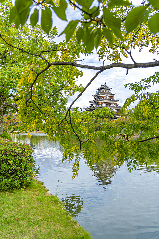 View of Hiroshima Castle, with museum, reflecting in Moat, Motomachi, Naka Ward, Hiroshima, Honshu, Japan