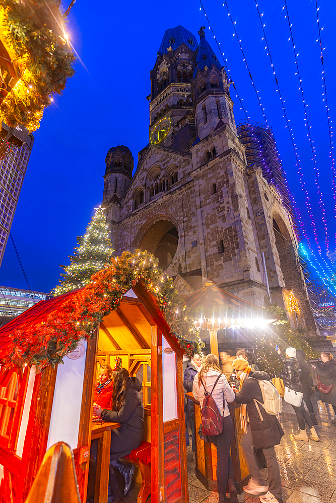 View of Kaiser Wilhelm Memorial Church and market stalls at Christmas, Breitscheidplatz, Berlin, Germany, Europe