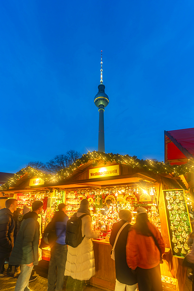 View of Berlin TV Tower and Christmas market in Wasserkaskaden at dusk, Mitte, Berlin, Germany, Europe