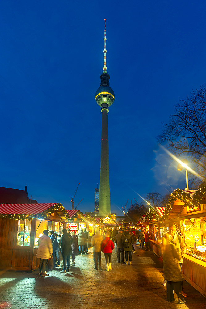 View of Berlin TV Tower and Christmas market in Wasserkaskaden at dusk, Mitte, Berlin, Germany, Europe