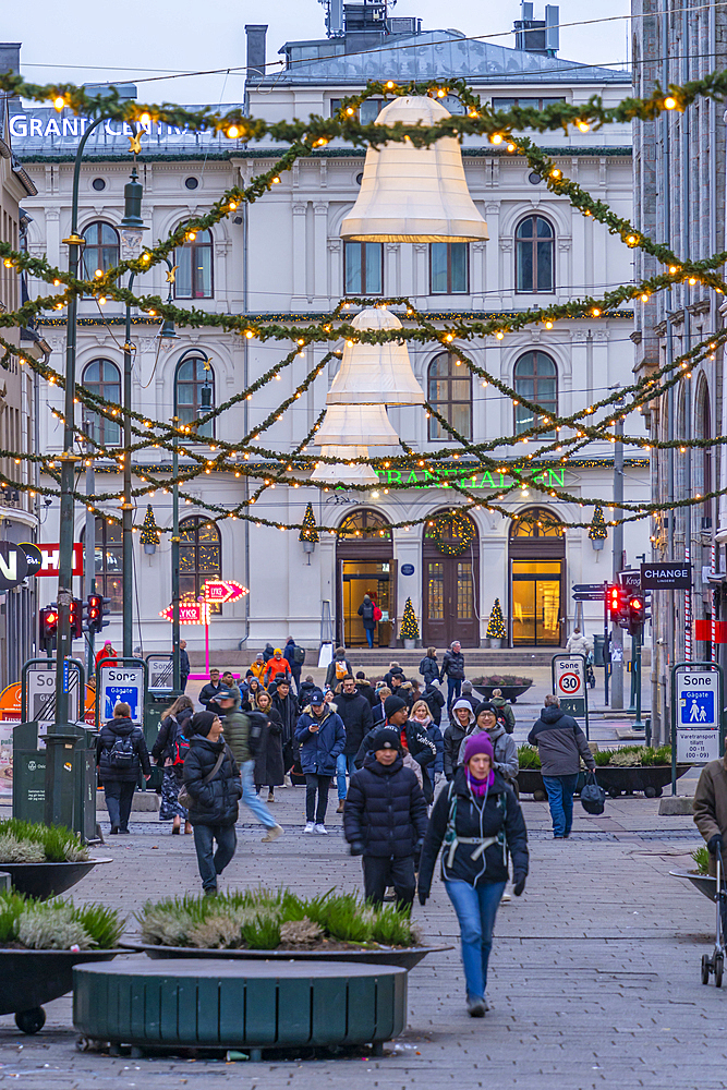 View of Christmas decorations and Oslo Central Station on Karl Johans Gate at dusk, Oslo, Norway, Scandinavia, Europe