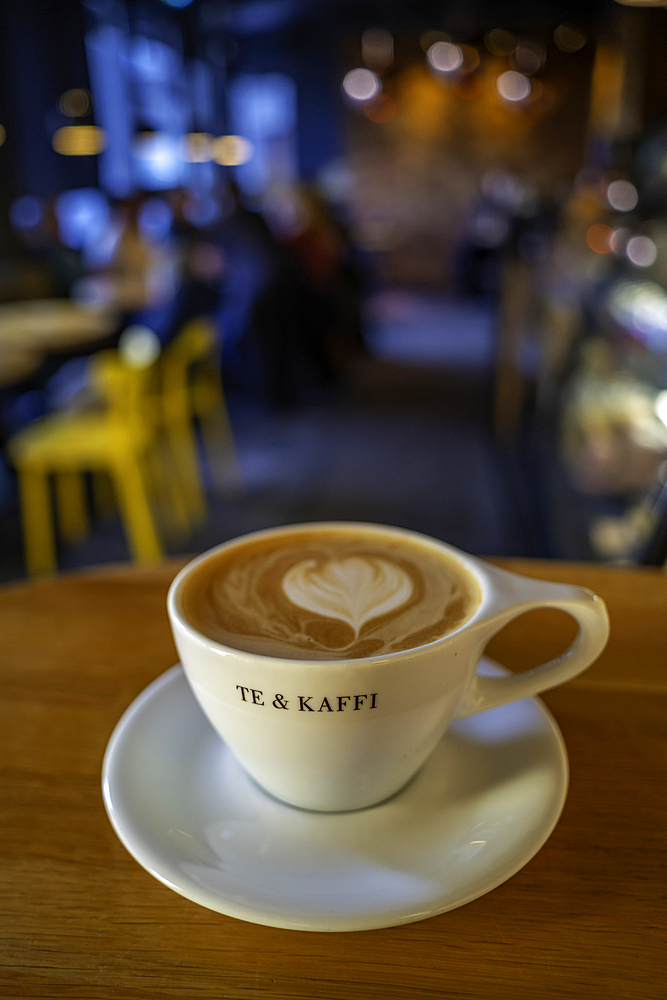 View of 'te & kaffe' cup in cafe in the city centre, Reykjavik, Iceland, Europe