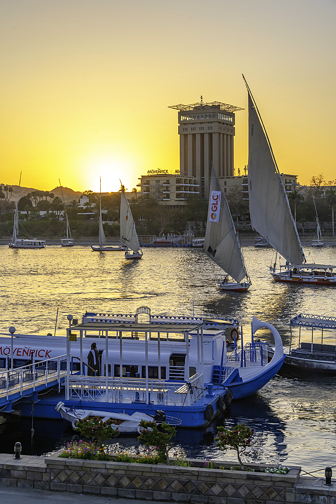 View of fellucas on the Nile river during sunset, Aswan, Nubia, Egypt, North Africa, Africa