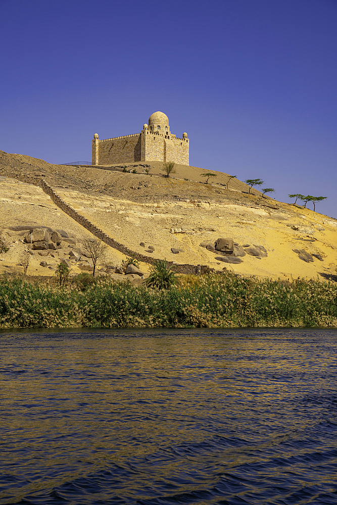 View of the Nile river and Aga Khan Mausoleum from small boat in Aswan, Aswan, Nubia, Egypt, North Africa, Africa