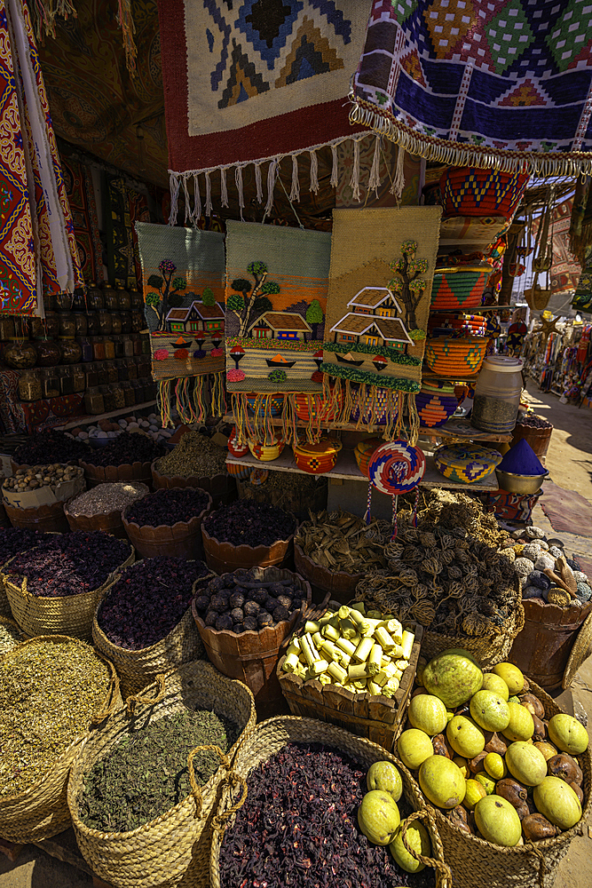 View of colourful market stalls at Nagaa Suhayl Gharb on the Nile river near Aswan, Aswan, Nubia, Egypt, North Africa, Africa