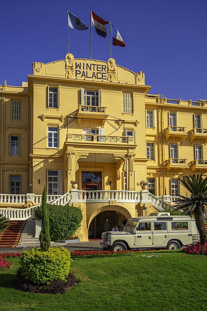 View of the Winter Palace Hotel on the corniche in Luxor on a sunny day, Luxor, Egypt, Africa