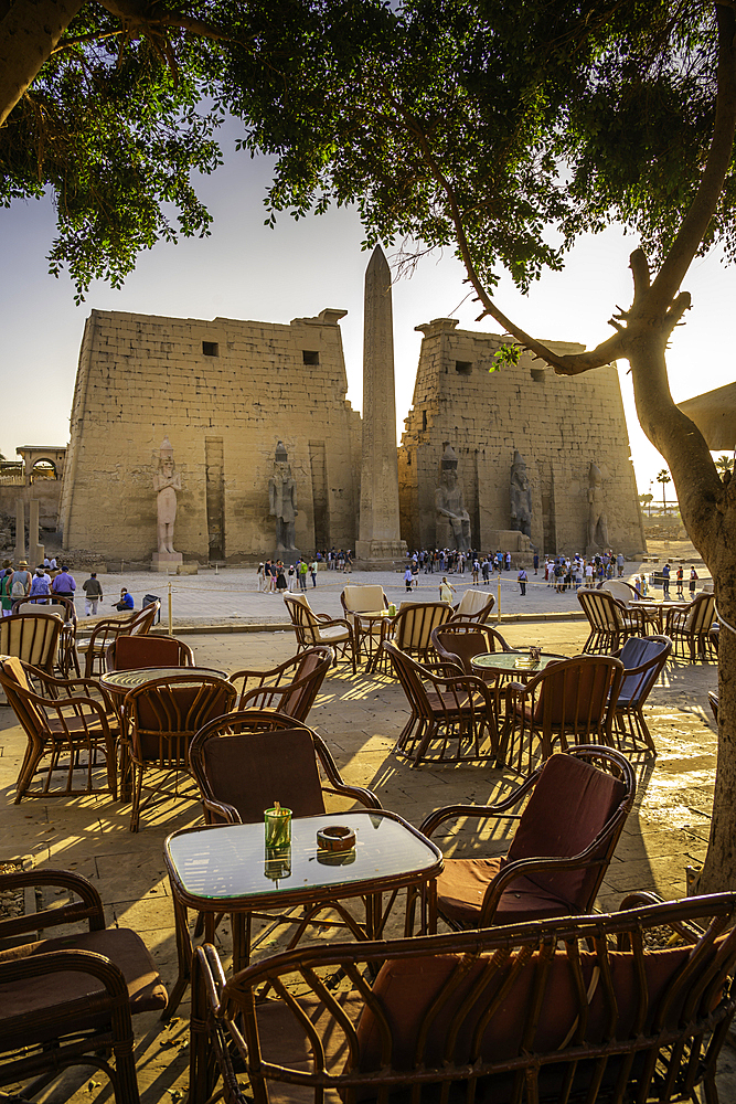 View of Luxor Temple and cafe during golden hour, Luxor, Egypt, Africa