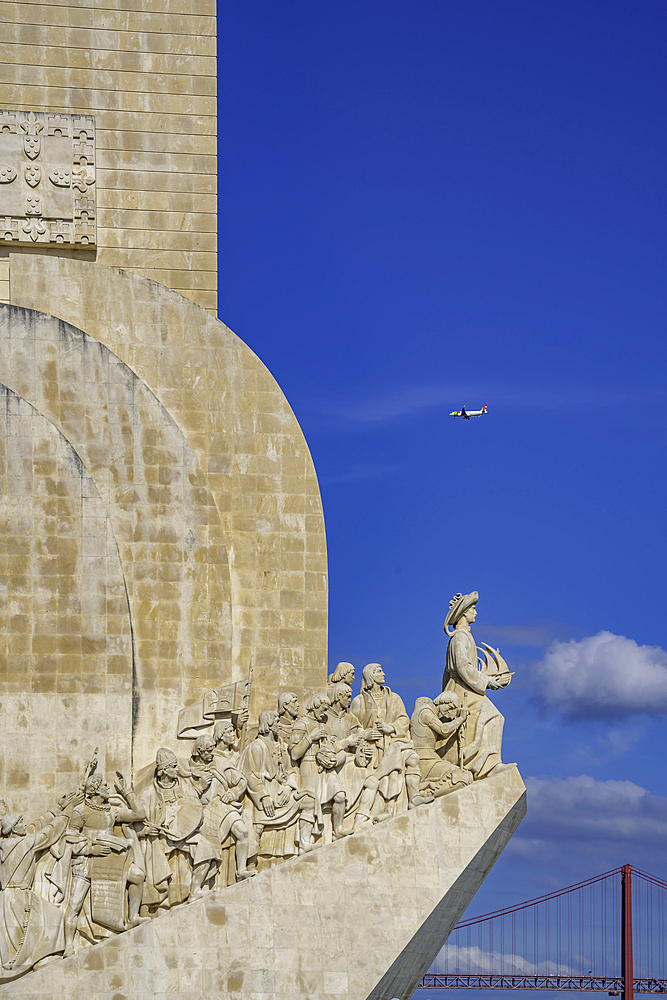 View of Monument to the Discoveries (Padrão dos Descobrimentos) and 25 April Bridge on a sunny day, Lisbon, Portugal, Europe