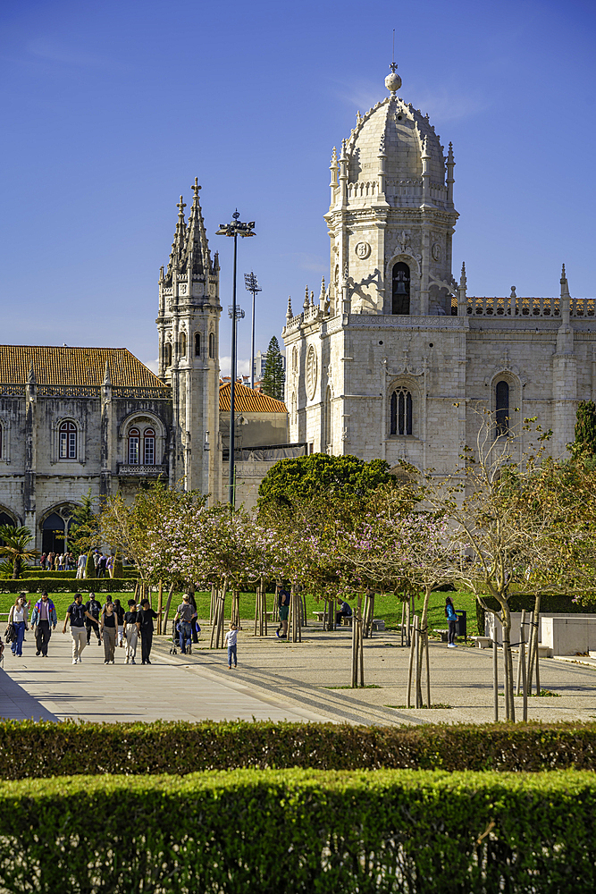View of Jerónimos Monastery (Monastery of the Hieronymites) from Empire Square Garden on a sunny day, Lisbon, Portugal, Europe