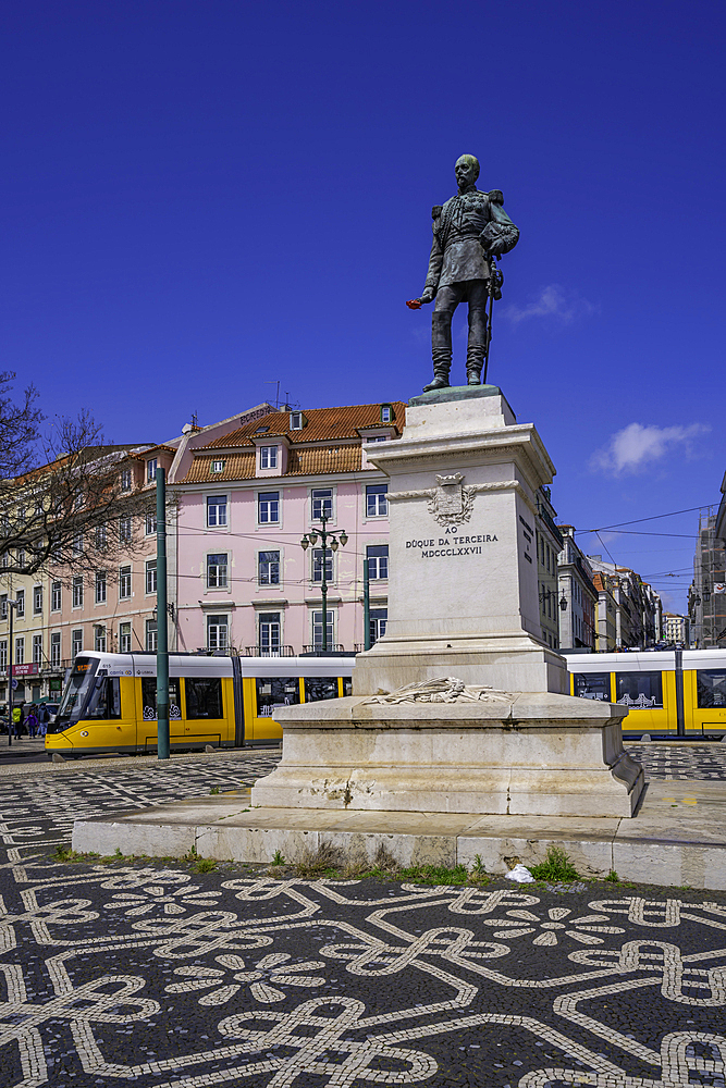 View of Duke of Terceira statue and a modern tram in PC Duque da Terceira on a sunny day, Lisbon, Portugal, Europe