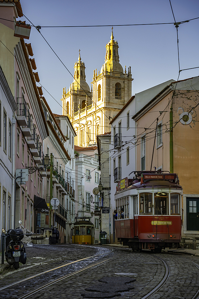 View of vintage tram and colourful buildings in the Alfama District on a sunny day, Lisbon, Portugal, Europe