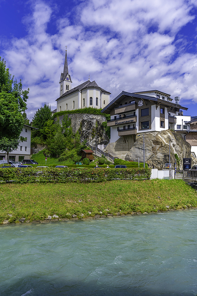View of Kaprun town and church on the hill on a sunny day, Kaprun, Salzburg, Austria, Europe