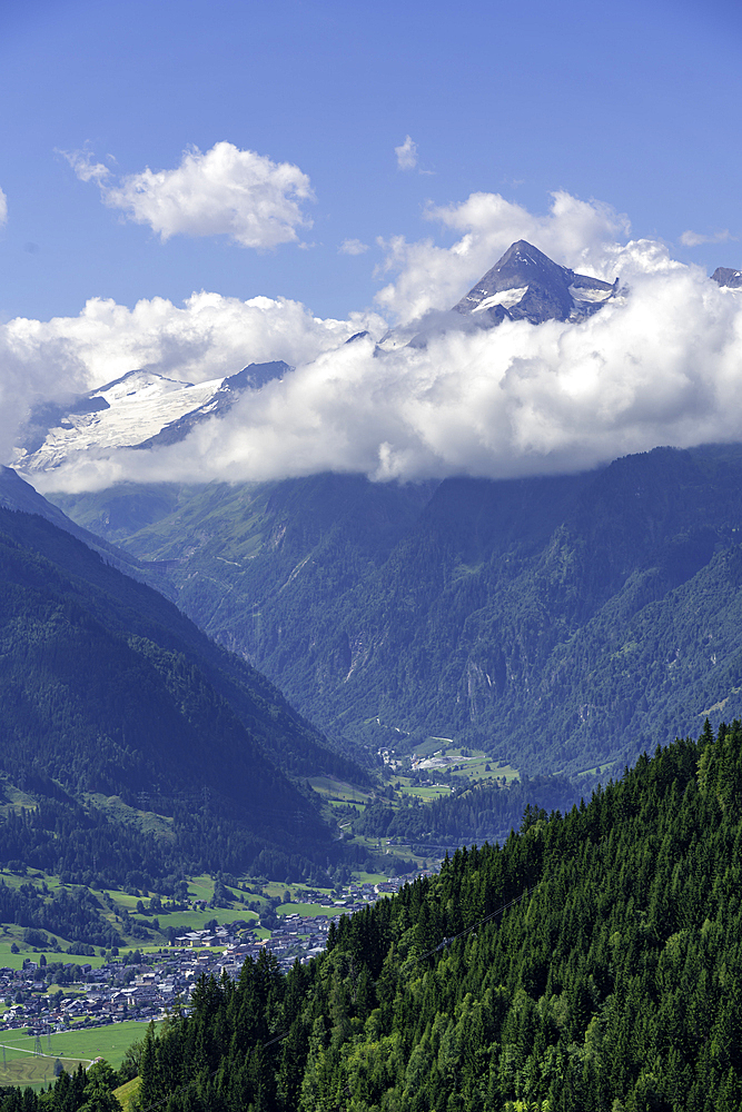View of mountains toward Grossglockner from Plettsaukopf Reservoir on a sunny day, Bruckberg, Salzburg, Austria, Europe
