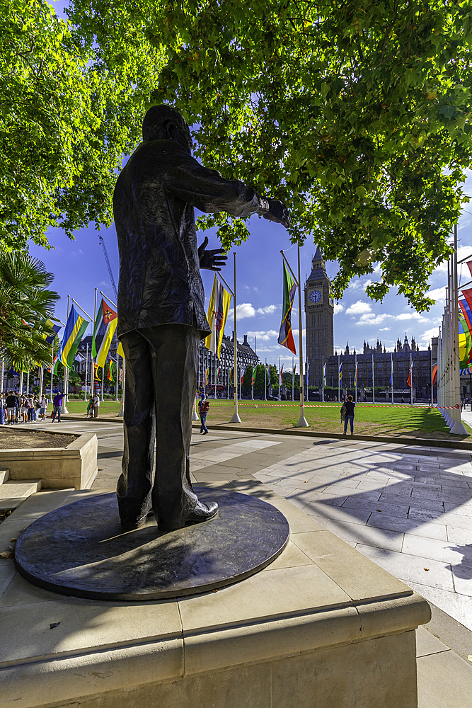 View of Nelson Mandella statue and Big Ben clock tower in Parliament Square during summer, Westminster, London, England, United Kingdom, Europe